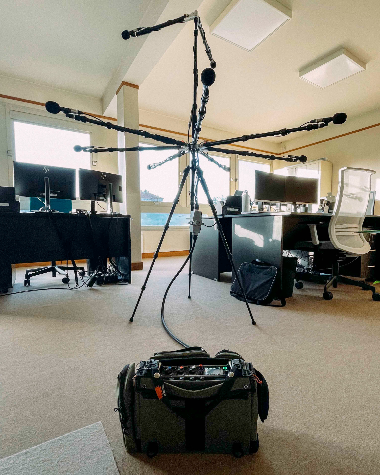 Audio Field ATMOS Tree microphone array set up in an office with desks and windows